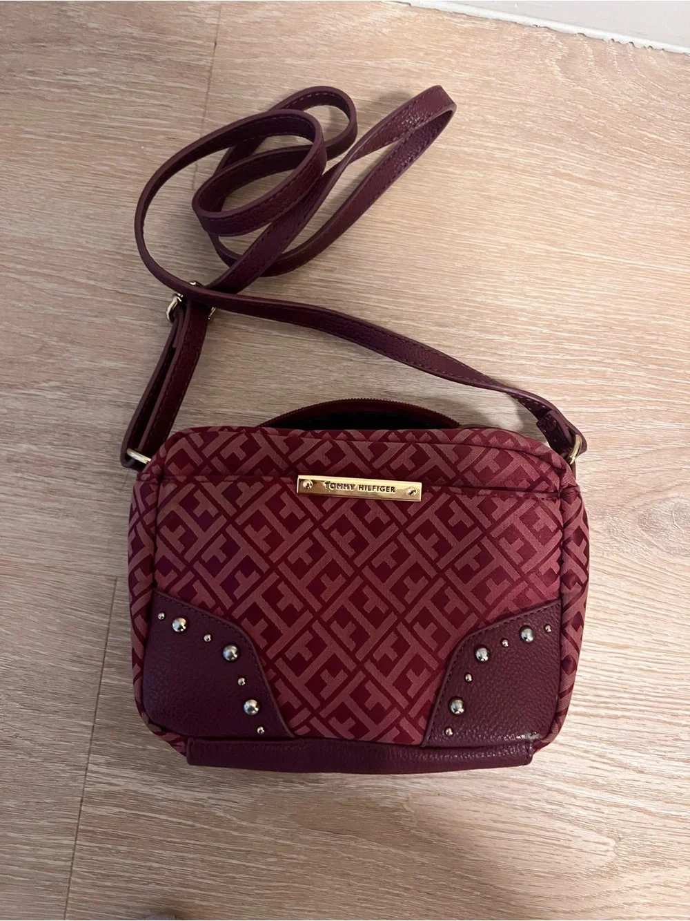 Tommy Hilfiger Burgundy Monogram Camera bag with Gold Plate